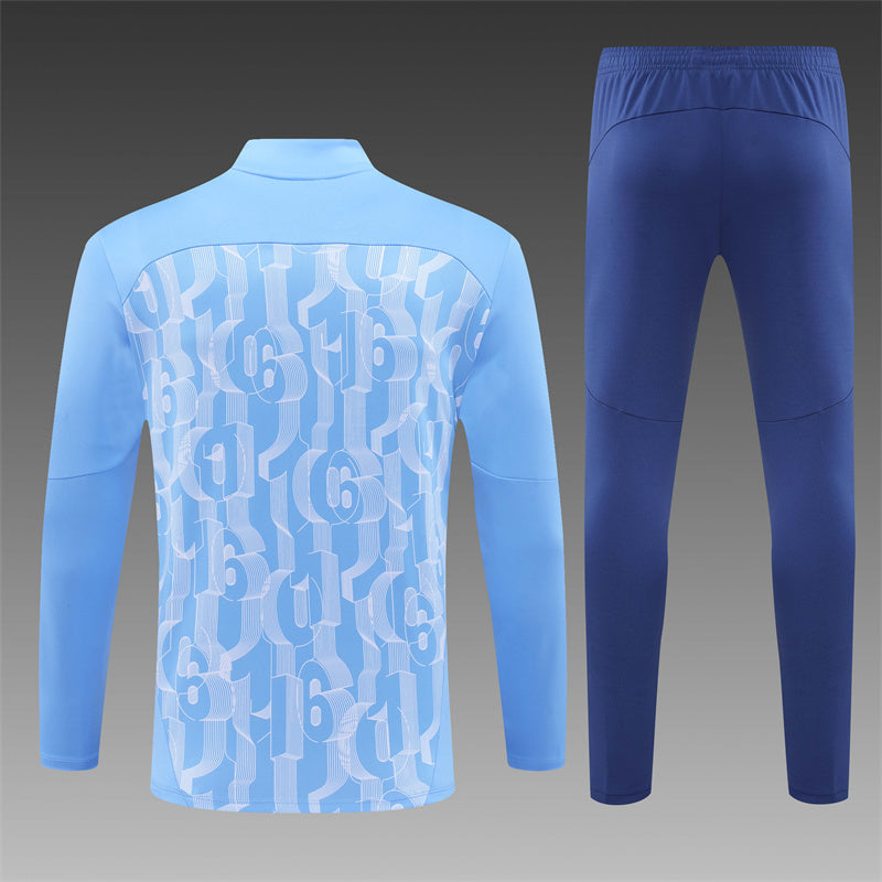 Manchester City with the 2024/2025 Blue Tracksuit