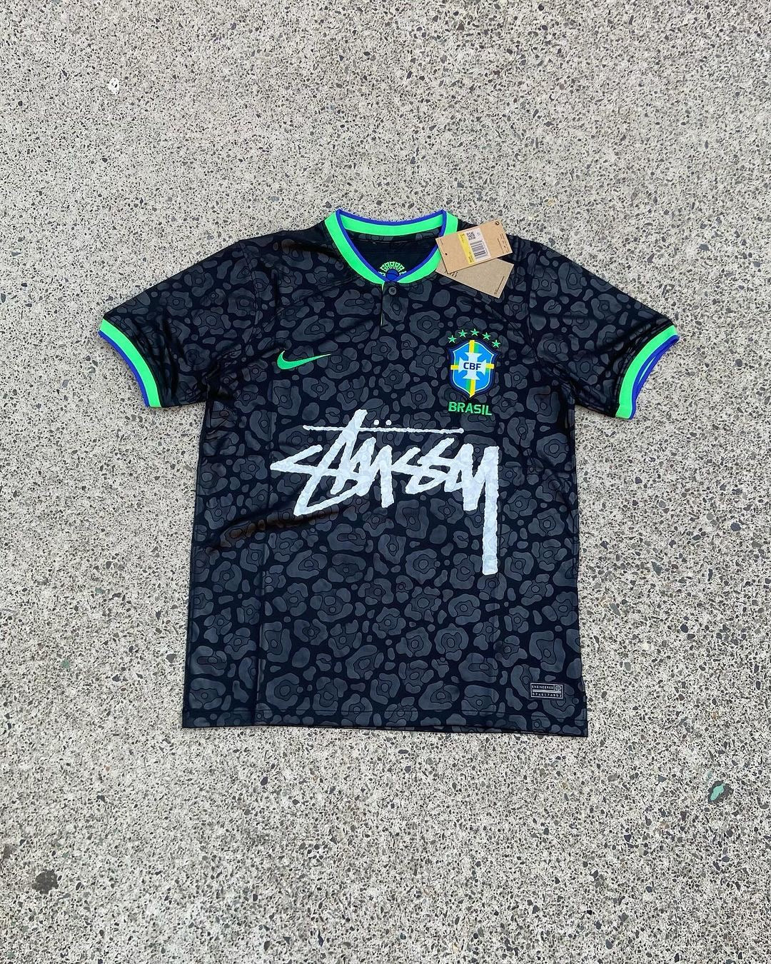 Brazil Black x Stussy Special Edition soccer jersey, featuring a black base with yellow and green accents, the Stussy logo, and the Brazilian flag.